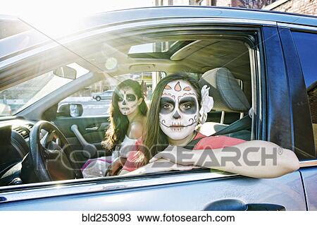 Women in car wearing skull face paint View Large Photo Image Stock Image - Women in car wearing skull face paint. Fotosearch