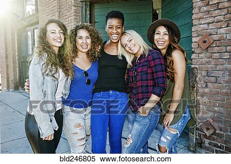 Women posing on sidewalk in city View Large Photo Image Stock Photography - Women posing on sidewalk in city. Fotosearch