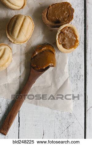 Wooden spoon with filling for cookies View Large Photo Image Stock Photography - Wooden spoon with filling for cookies. Fotosearch