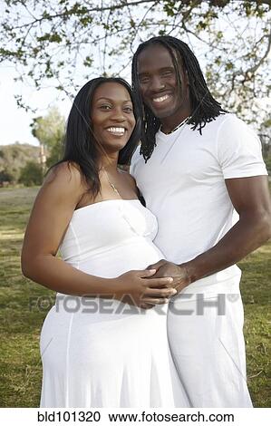 African American couple hugging in park View Large Photo Image Stock Image - African American couple hugging in park. Fotosearch
