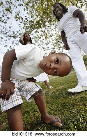 Stock Photo - African American family enjoying park. Fotosearch