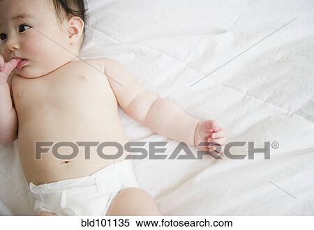 Asian baby girl laying on blanket View Large Photo Image Stock Photography - Asian baby girl laying on blanket. Fotosearch