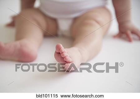 Stock Photography - Asian baby girl's feet. Fotosearch