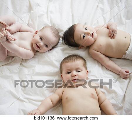 Babies laying on blanket View Large Photo Image Stock Photograph - Babies laying on blanket. Fotosearch