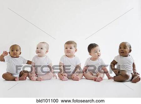 Stock Image - Babies sitting on floor together. Fotosearch
