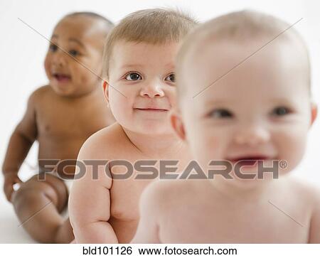 Stock Photograph - Babies sitting together. Fotosearch