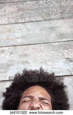 Black man squinting View Large Photo Image Stock Image - Black man squinting. Fotosearch