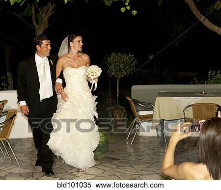 Stock Photography - Bridal couple arriving at reception. Fotosearch