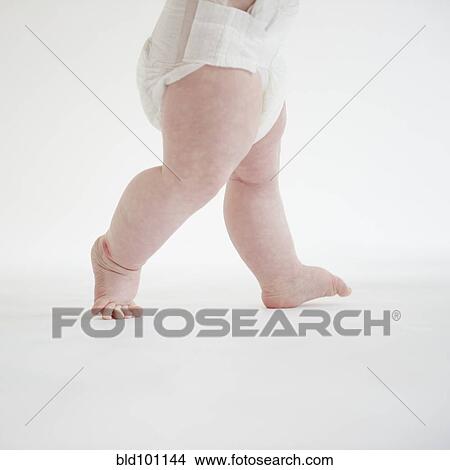 Picture - Caucasian baby girl walking. Fotosearch