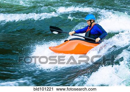 Caucasian boy kayaking on river View Large Photo Image Stock Image - Caucasian boy kayaking on river. Fotosearch