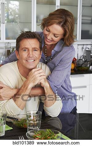 Stock Photo - Caucasian couple eating salad. Fotosearch