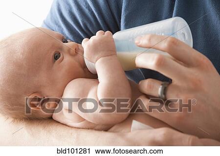 Caucasian father feeding baby girl View Large Photo Image Stock Image - Caucasian father feeding baby girl. Fotosearch