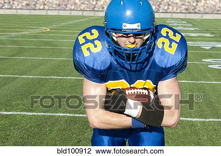 Caucasian football player running with ball View Large Photo Image Stock Image - Caucasian football player running with ball. Fotosearch
