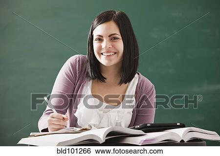 Stock Photograph - Caucasian student doing homework. Fotosearch