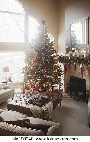 Christmas tree and decorations in living room View Large Photo Image Stock Image - Christmas tree and decorations in living room. Fotosearch