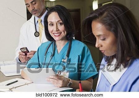 Doctor and nurses working in hospital View Large Photo Image Stock Image - Doctor and nurses working in hospital. Fotosearch