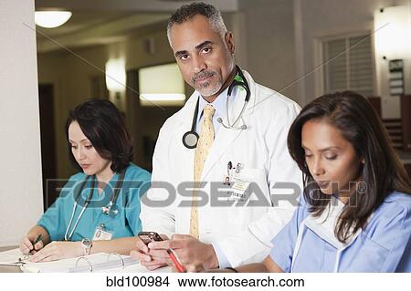 Doctors and nurse working in hospital View Large Photo Image Picture - Doctors and nurse working in hospital. Fotosearch