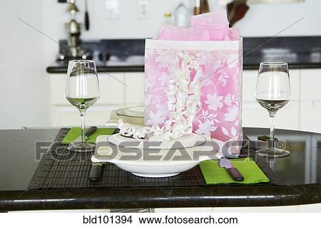 Picture - Gift on dining room table. Fotosearch