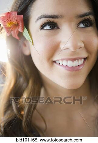 Hispanic woman with flower in her hair View Large Photo Image Stock Photography - Hispanic woman with flower in her hair. Fotosearch