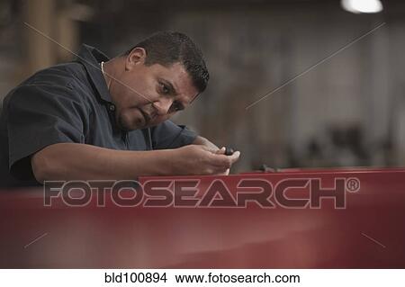 Hispanic worker working in warehouse View Large Photo Image Picture - Hispanic worker working in warehouse. Fotosearch