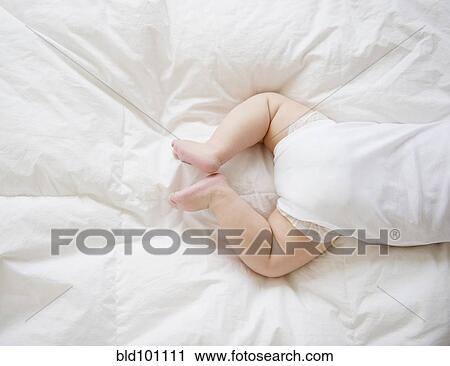 Mixed race baby boy laying on floor View Large Photo Image Stock Image - Mixed race baby boy laying on floor. Fotosearch