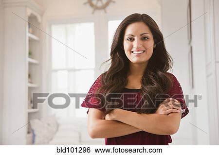Mixed race woman with arms crossed View Large Photo Image Stock Photograph - Mixed race woman with arms crossed. Fotosearch