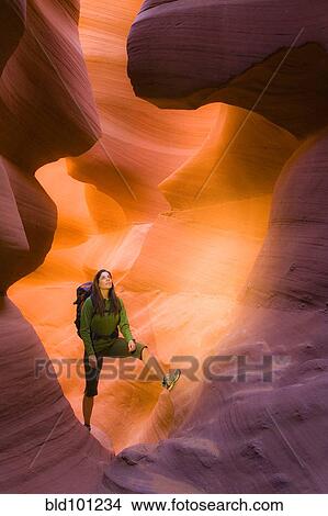 Picture - Persian woman hiking in canyon. Fotosearch