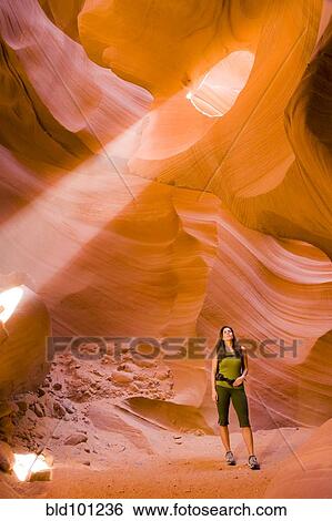 Stock Photograph - Persian woman hiking in canyon. Fotosearch