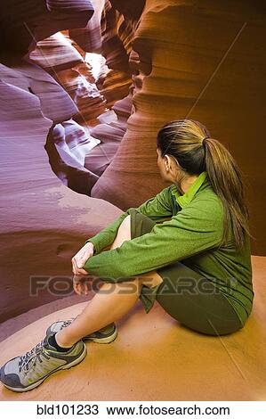 Stock Image - Persian woman sitting in canyon. Fotosearch