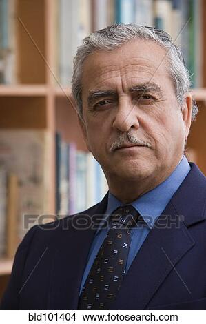 Picture - Serious Hispanic businessman. Fotosearch