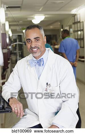 Stock Photo - Smiling African American doctor in hospital. Fotosearch