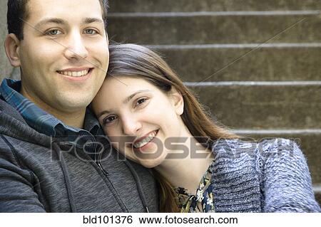Smiling Caucasian couple hugging View Large Photo Image Stock Photograph - Smiling Caucasian couple hugging. Fotosearch