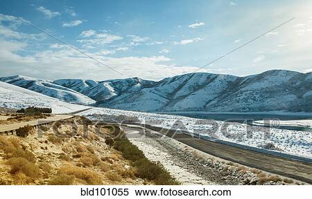 Stock Photography - Snow covered valley and hills. Fotosearch