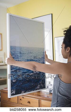 African American woman admiring large photograph of ocean View Large Photo Image Stock Photography - African American woman admiring large photograph of ocean. Fotosearch