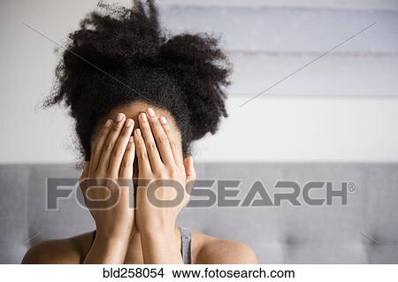 African American woman covering face with hands View Large Photo Image Picture - African American woman covering face with hands. Fotosearch