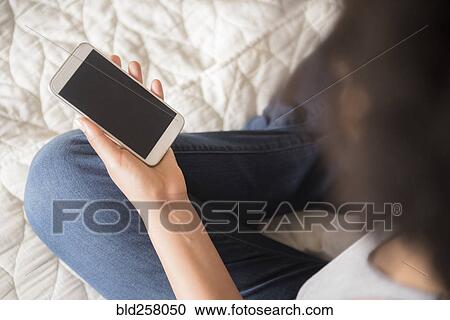 African American woman holding cell phone View Large Photo Image Stock Image - African American woman holding cell phone. Fotosearch