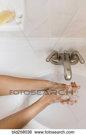 African American woman washing hands with soap View Large Photo Image Stock Photograph - African American woman washing hands with soap. Fotosearch