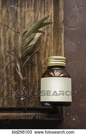 Alternative medicine jar with blank label near leaf View Large Photo Image Stock Image - Alternative medicine jar with blank label near leaf. Fotosearch