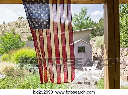 American flag hanging in backyard View Large Photo Image Stock Image - American flag hanging in backyard. Fotosearch