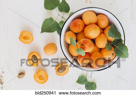 Stock Image - Apricots in bowl. Fotosearch