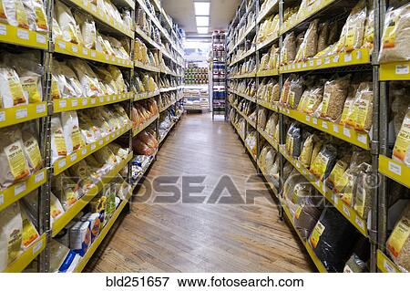 Bags of food in supermarket aisle View Large Photo Image Stock Photo - Bags of food in supermarket aisle. Fotosearch