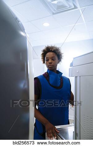 Black hospital technician wearing protective vest View Large Photo Image Stock Image - Black hospital technician wearing protective vest. Fotosearch