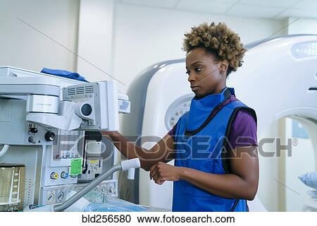 Stock Image - Black hospital technician wearing protective vest. Fotosearch
