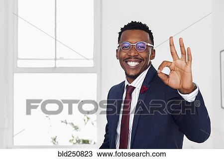 Black man gesturing okay in gallery View Large Photo Image Stock Image - Black man gesturing okay in gallery. Fotosearch