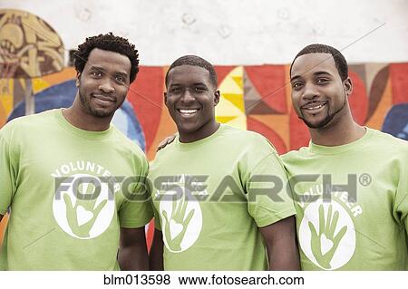 Stock Photo - Black volunteers standing together. Fotosearch