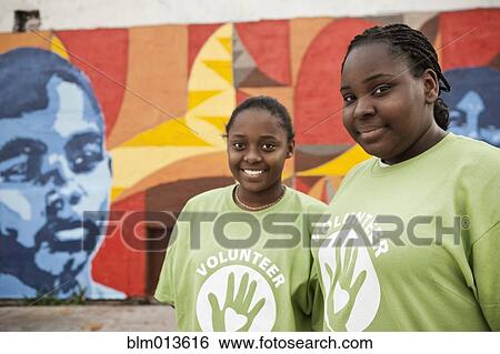 Stock Photograph - Black volunteers standing together. Fotosearch