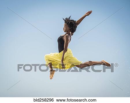 Black woman dancing and jumping View Large Photo Image Stock Photograph - Black woman dancing and jumping. Fotosearch
