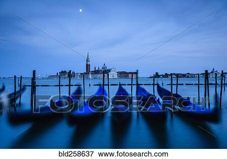 Blue gondolas at night View Large Photo Image Stock Photo - Blue gondolas at night. Fotosearch