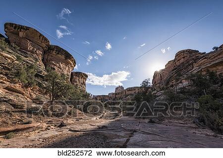 Stock Image - "Blue sky over canyon in Moab, Utah, United States". Fotosearch