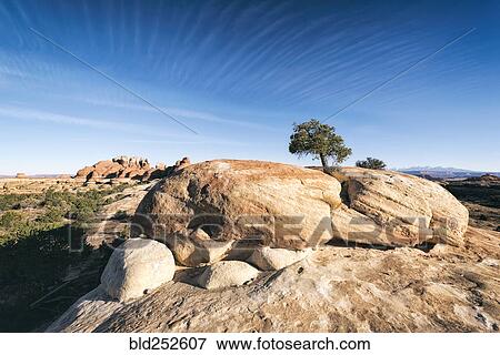 Stock Photo - "Blue sky over rocks in desert, Moab, Utah, United States". Fotosearch